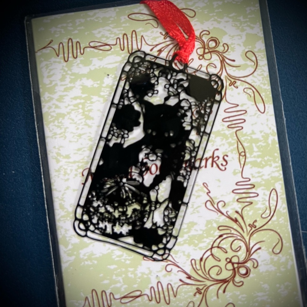 Black cat in stained glass window metal ornament or bookmark with red ribbon